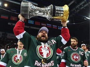 Andrei Markov hoists the Gagarin Cup trophy after his team wins the KHL championship on April 22, 2018.