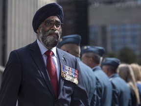 Defence Minister Harjit Sajjan displays his service medals as he leaves a ceremony in which the Royal Canadian Air Force were presented with new ceremonial flags in Toronto on Friday, Sept. 1, 2017. Valérie Plante says she is open to Snowdon councillor Marvin Rotrand's proposal that officers in the Montreal force be allowed to wear religious garments.