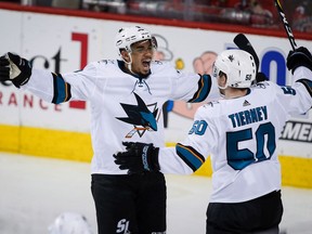 FILE - In this March 16, 2018, file photo, San Jose Sharks left wing Evander Kane (9) celebrates his fourth goal with center Chris Tierney (50) during the third period of an NHL hockey game against Calgary Flames in Calgary, Alberta. For someone few teams were willing to gamble on acquiring at the NHL trade deadline in late February, Evander Kane has provided the San Jose Sharks a tremendous boost in mounting their late-season playoff push.