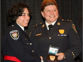 Ottawa police approved a more inclusive uniform after Muslim Constable Lila Shibley (left) publicly suggested it would encourage more young girls from diverse backgrounds to apply. (Jean Levac / POSTMEDIA NEWS)