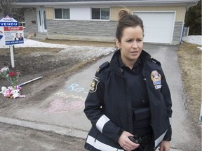 Quebec police spokesperson Cyndi Paré reponds to reporters' questions as she stands in front the driveway of the house where the body of two-year-old Rosalie Gagnon was found in a garbage pail, Thursday, April 19, 2018 in Quebec City.
