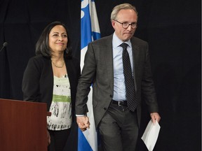 Quebec Public Safety Minister Martin Coiteux leaves a news conference with his wife, Monica, in Montreal, Friday, April 27, 2018, where he announced he would be retiring from politics: "I got into politics to change things ... not to do it as a career," he said.