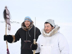 Anthony Kawapit (left) and Aisa Sivuarapik (right) arrive at Salluit after a three-day from Ivujivik, Quebec's northernmost community.