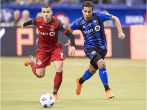 Toronto FC midfielder Ager Aketxe, left, battles with Montreal Impact midfielder Saphir Taider, right, during second half MLS action in Montreal on March 17, 2018. The first priority for the Montreal Impact when they face Atlanta United on Saturday is to avoid having anyone sent off.