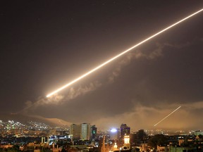 Damascus skies erupt with surface to air missile fire as the U.S. launches an attack on Syria targeting different parts of the Syrian capital Damascus, Syria, early Saturday, April 14, 2018. Syria's capital has been rocked by loud explosions that lit up the sky with heavy smoke as U.S. President Donald Trump announced airstrikes in retaliation for the country's alleged use of chemical weapons.