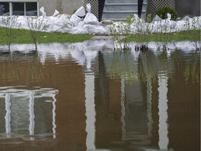 Sandbags protect the basement of a house surrounded by floodwaters in Vaudreuil-Dorion west of Montreal, Tuesday, May 9, 2017.