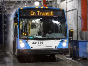 A bus gets washed at the STM Stinson Transport Centre on Friday March 18, 2016, in Montreal.