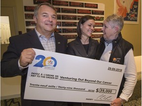 Sarah Bi (centre), shares a moment of happiness with Doreen Edward (right) and Livio Di Francesco (left) of VOBOC after the West Island Community Shares annual cheque distribution gala in Dorval last Thursday.