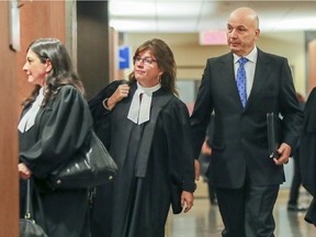 Frank Zampino, former head of Montreal's executive committee, follows his lawyers into the courtroom for the verdicts in the Contrecoeur fraud trial in Montreal Wednesday May 2, 2018.