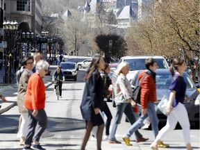 MONTREAL, QUE.: MAY 8, 2018-- Pedestrians, cyclist and motorists navigate McGill College Avenue in Montreal on Tuesday May 8, 2018. (Allen McInnis / MONTREAL GAZETTE)