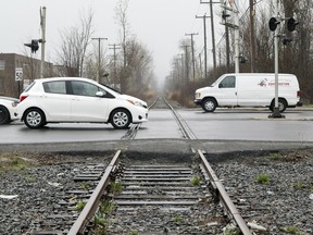Traffic crosses the Doney Spur train tracks that cross Sources Blvd. just north of Hymus in Pointe Claire, west of Montreal Friday May 4, 2018. (John Mahoney / MONTREAL GAZETTE) ORG XMIT: 60594 - 0909