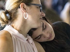 Clément's Ouimet mother, Catherine Ouimet, and girlfriend, Livia Martin, at a news conference on Tuesday to announce plans for the 2018 Ride of Silence on May 16. The cyclist died after an accident on Mount Royal on Oct. 4, 2017.