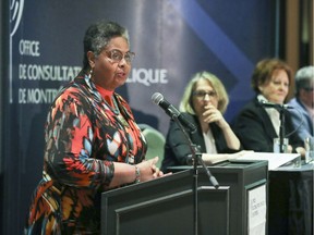 Dominique Ollivier, president of the Office de consultations publique de Montréal, delivers opening address on Thursday night at public information meeting on the city's plans to close Camillien-Houde Way to through traffic.