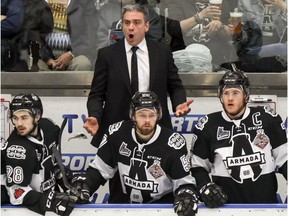 Blainville-Boisbriand Armada head coach and GM Joel Bouchard yells at the officials behind players Samuel Leblanc, left, Charles-Antoine Giguere and Alexandre Alain, right, during Quebec Major Junior Hockey League playoff game Friday night.