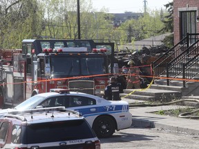 Firefighters and police at the scene of a fatal fire in LaSalle on Wednesday, May 16, 2018. A 61-year-old woman was killed in the blaze, which started Tuesday night.