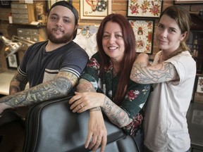 “The level of tattooing in Montreal, and around the world, has exploded. They’re artists, for real,” says Tattoo Nouvelle Ère organizer Geneviève Mecteau, right, with co-organizer William Q. Gauthier and convention founder Pascale Quesnel at the MTL Tattoo shop.