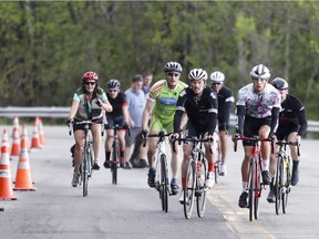 Cyclists climb Camillien- Houde Rd. during the Cyclovia event on Mount Royal in Montreal on Sunday, May 20, 2018.  The eastern portion of the road was closed to traffic for the morning to allow cyclists, runners and pedestrians to enjoy car-free exercise on the mountain.