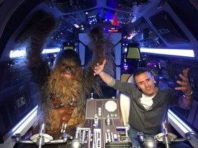 Chewbacca and Gazette writer T'Cha Dunlevy ham it up in the Millennium Falcon cockpit.
