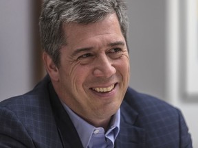 Paul Wilson, the new man in charge of public relations for the Canadiens, smiles during an interview in his office at Montreal's Sun Life Building on May 24, 2018.