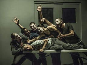 Jonathon Young (on table) is tormented — or perhaps consoled? — by a nightmarish cabaret in Betroffenheit, which closes the Festival TransAmériques.