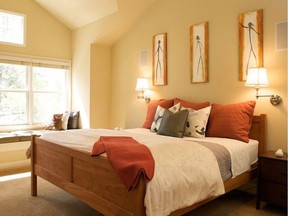 A sun-filled and happy guest room gets entirely painted with a mellow yellow. (Golden Retriever 2165-30.)