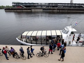 A crowd lines up to board the Old Port to Pointe aux Trembles water taxi in the Old Port Montreal on Monday May 28, 2018.