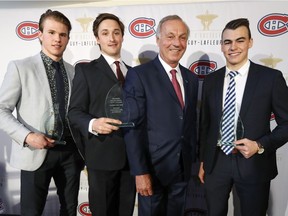 Guy Lafleur stands with recipients of his Awards of Excellence and Merit for 2017-2018, from left, Alexandre Alain, Carl Neill and William Lemay, in Montreal Tuesday May 29, 2018.