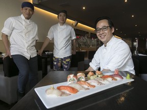 Chef-owner Shinichi Duong, right, with chef Satoshi Matsumoto, far left, and chef Eric at Saiko Bistrot Izakaya.