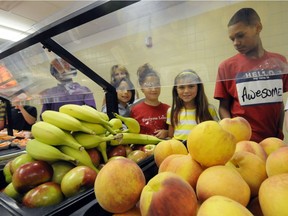 Students select food items in a Rotterdam, N.Y. school cafeteria : New York City announced free lunches for all 1.1 million kindergarten to Grade 12 students attending its public schools at the start of this year.