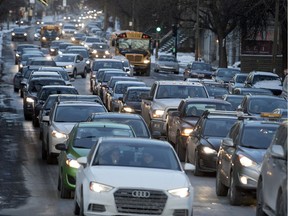 Cars fill St-Antoine St. as they work their way along an alternative route out of the downtown core in Montreal on Monday December 11, 2017. Any other form of transportation, from walking to biking to public transit, is more desirable for public health and quality of urban life, Jason Prince and Eric Shragge write.