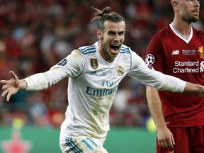 Real Madrid's Gareth Bale celebrates after scoring his side's third goal during the Champions League Final soccer match between Real Madrid and Liverpool at the Olimpiyskiy Stadium in Kiev, Ukraine, on Saturday, May 26, 2018.