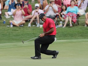 Tiger Woods of the United States reacts to a missed putt on the 11th green during the final round of THE PLAYERS Championship on the Stadium Course at TPC Sawgrass on Sunday, May 13, 2018, in Ponte Vedra Beach, Fla.