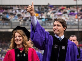 Canadian Prime Minister Justin Trudeau gives a thumbs up as he arrives for New York University's commencement ceremony at Yankee Stadium, May 16, 2018 in the Bronx borough of New York City. Trudeau, who was honoured with a honorary doctor of laws degree, is delivering a commencement address to the graduating class of 2018.