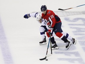 Brayden Point of the Tampa Bay Lightning skates against Lars Eller, right, of the Washington Capitals in the first period of Game 6 of the Eastern Conference finals during the 2018 NHL Stanley Cup Playoffs at Capital One Arena on May 21, 2018, in Washington.