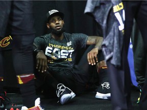 BOSTON, MA - MAY 27:  LeBron James #23 of the Cleveland Cavaliers sits on the floor after defeating the Boston Celtics 87-79 in Game Seven of the 2018 NBA Eastern Conference Finals to advance to the 2018 NBA Finals at TD Garden on May 27, 2018 in Boston, Massachusetts. NOTE TO USER: User expressly acknowledges and agrees that, by downloading and or using this photograph, User is consenting to the terms and conditions of the Getty Images License Agreement.