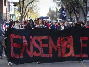 Anti-fascist protestors march toward the home of neo-Nazi Zeiger in the Rosemont borough of Montreal on Saturday, May 12, 2018.
