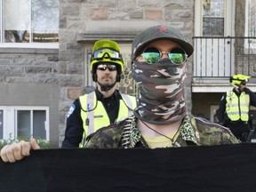 Anti-fascist protesters march toward the home of neo-Nazi Zeiger in Rosemont on Saturday. The march followed a postering campaign in which images of Zeiger and other suspected Montreal white supremacists were put up in a bid to “make racists afraid again.”