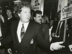 Federal Conservative Environment minister Jean Charest is greeted by well-wishers at Dorval Airport in Montreal.