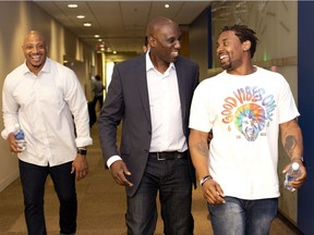 Alouettes' general manger Kavis Reed, centre, with John Bowman and Tyrell Sutton in Montreal on May 4.