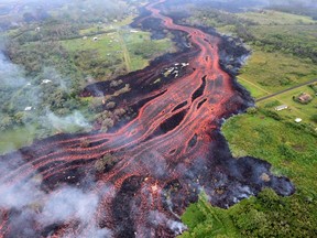 This US Geological Survey image shows channelized lava emerging on K'lauea Volcano's lower East Rift Zone May 19, 2018, on Hawaii's Big Island.