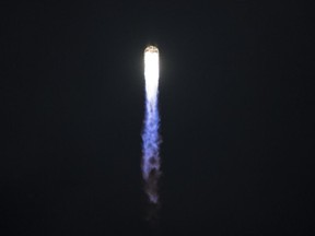 In this image released by NASA, the Orbital ATK Antares rocket, with the Cygnus spacecraft onboard, launches from Pad-0A, on May 21, 2018 at NASA's Wallops Flight Facility in Virginia. Food for astronauts, new space gardening gear and experiments to test extreme cold and how cement forms in weightlessness blasted off Monday to the International Space Station aboard Orbital ATK's unmanned Cygnus spacecraft.