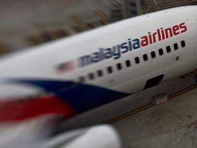 This file photo taken with a tilt and shift lens on June 16, 2014 shows a Malaysia Airlines plane parked on the tarmac at Kuala Lumpur International Airport in Sepang.