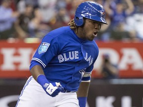 Toronto Blue Jays' Vladimir Guerrero Jr. celebrates his walk-off home run to defeat the St. Louis Cardinals 1-0 during spring training baseball action on March 27, 2018, in Montreal.