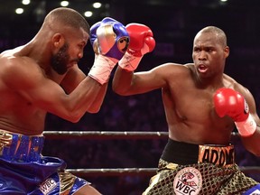 Quebecer Adonis Stevenson, right, and Badou Jack exchange blows during first round WBC light-heavyweight championship boxing action in Toronto on Saturday, May 19, 2018.