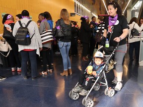 Djamila Hammar arrives with little 3 year-old Assalas Ghouti as daycare workers prepare to vote on a strike mandate May 17, 2018.