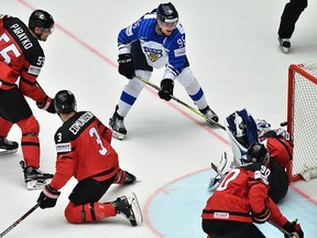 Finland's Mikko Rantanen (top right) scores a goal during the group B match Canada vs Finland of the 2018 IIHF Ice Hockey World Championship at the Jyske Bank Boxen in Herning, Denmark, on Saturday, May 12, 2018.