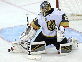 Vegas Golden Knights goaltender Marc-André Fleury makes a save against the Winnipeg Jets in Winnipeg on Feb. 1, 2018.