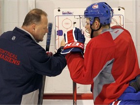 Canadiens assistant coach Gerard Gallant goes over a play with Alex Galchenyuk during practice at the Bell Sports Complex in Brossard on March 15, 2013.
