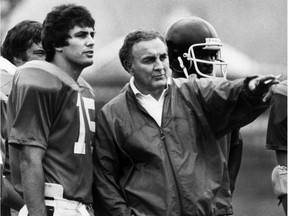 Montreal Alouettes head coach Joe Scannella talks with quarterback Vince Ferragamo during training camp in Victoriaville on May 28, 1981. Scannella, the Als' head coach from 1978-81, died on May 3, 2018, in Walnut Creek, Calif., following a long illness.