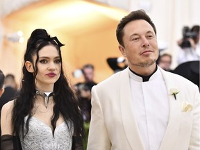 Grimes, left, and Elon Musk attend The Metropolitan Museum of Art's Costume Institute benefit gala celebrating the opening of the Heavenly Bodies: Fashion and the Catholic Imagination exhibition on Monday, May 7, 2018, in New York.